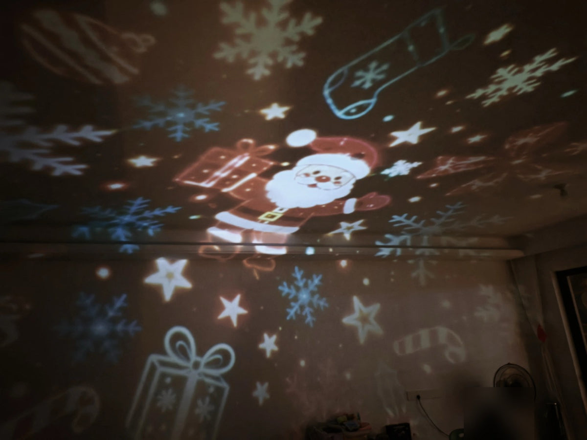 Real photo: DreamGlow Holiday Projector lighting up a living room with Santa and snowflakes
