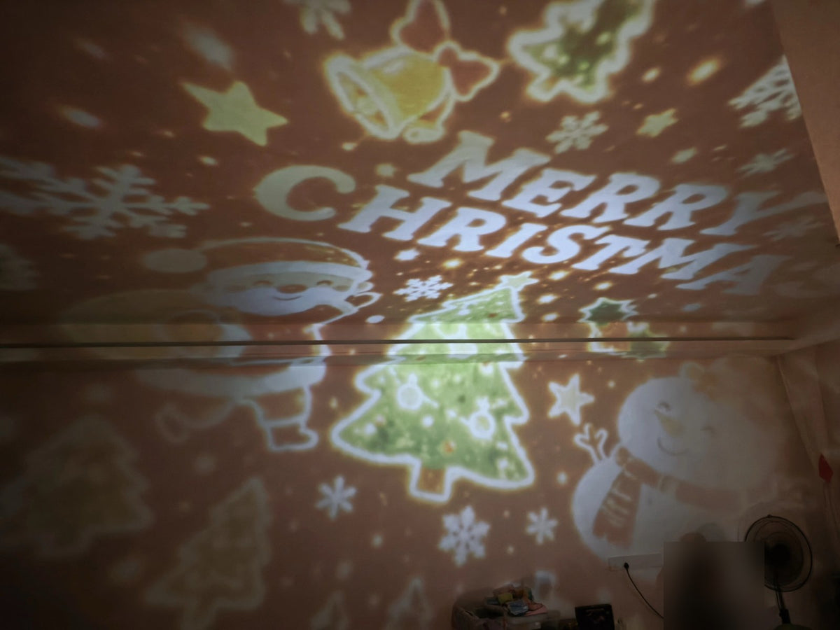 Real photo: Merry Christmas projection on wall and ceiling
