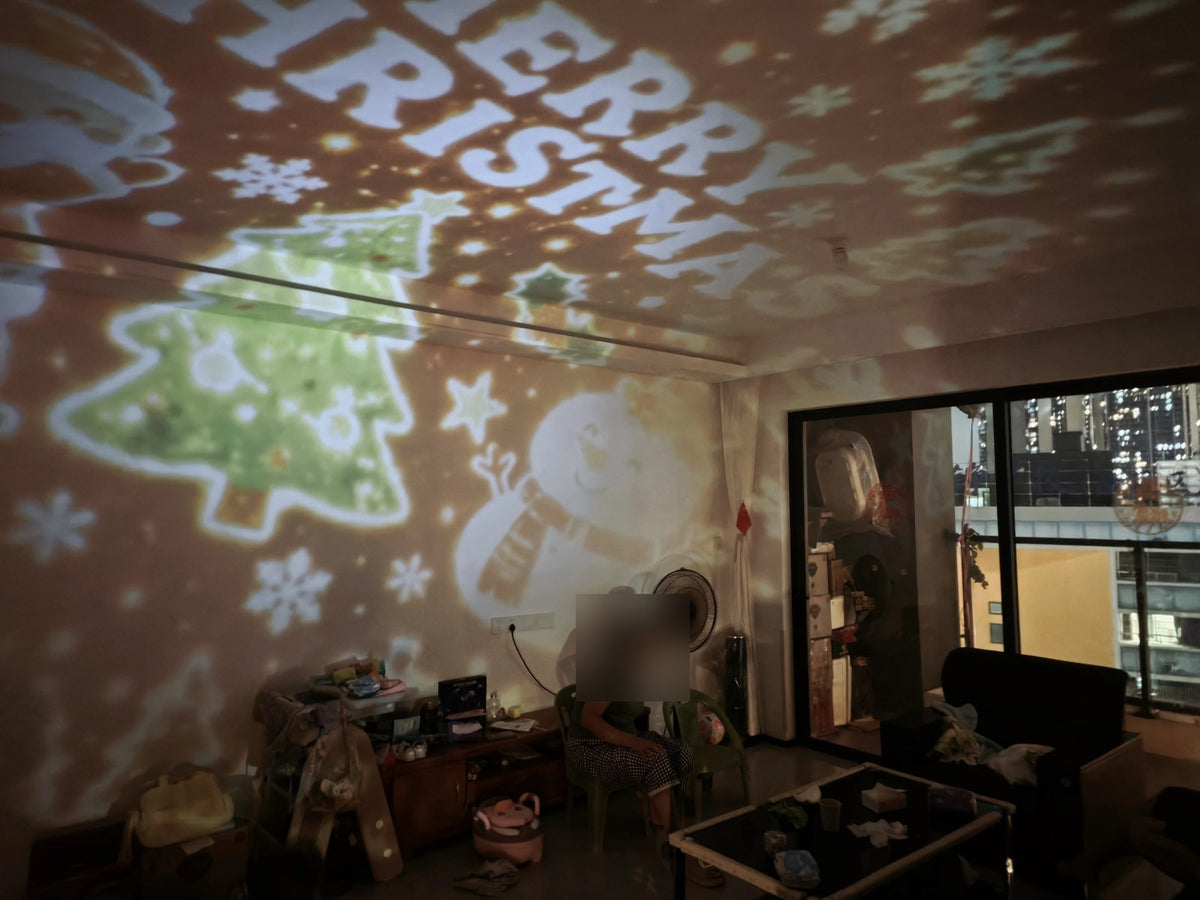 Real photo: Christmas tree and snowman projection filling a room